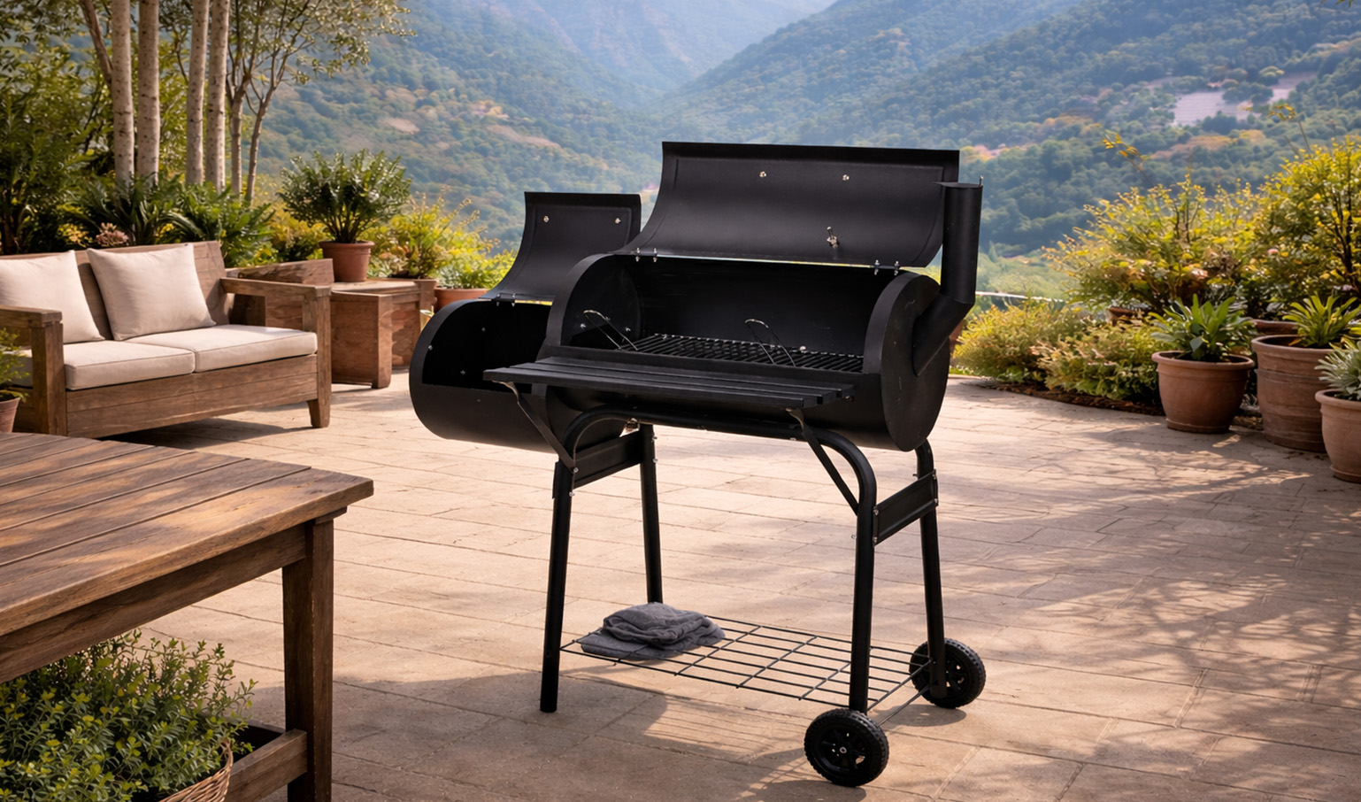 Outdoor charcoal grill on a scenic patio with mountain views.